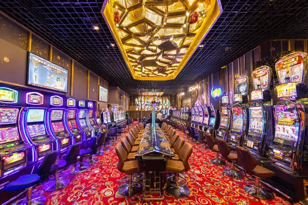 A close-up shot of golden coins falling around a spinning roulette wheel, representing immersive casino action at CWINZ.